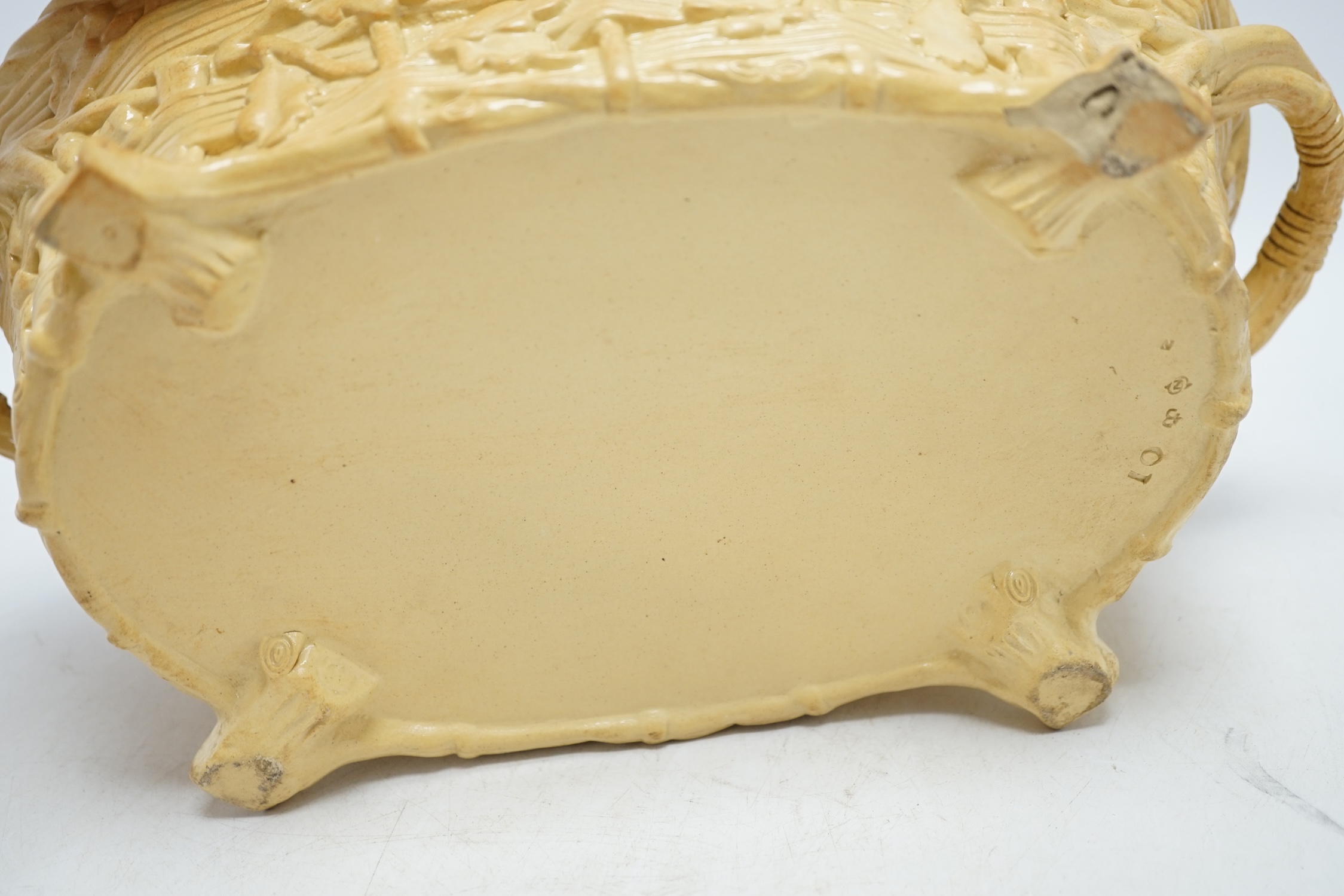 A 19th century Minton caneware game pie dish and cover, 33cm wide. Condition - acorn leaf tip and wing tip missing on cover, small chips to inner lip of tureen.